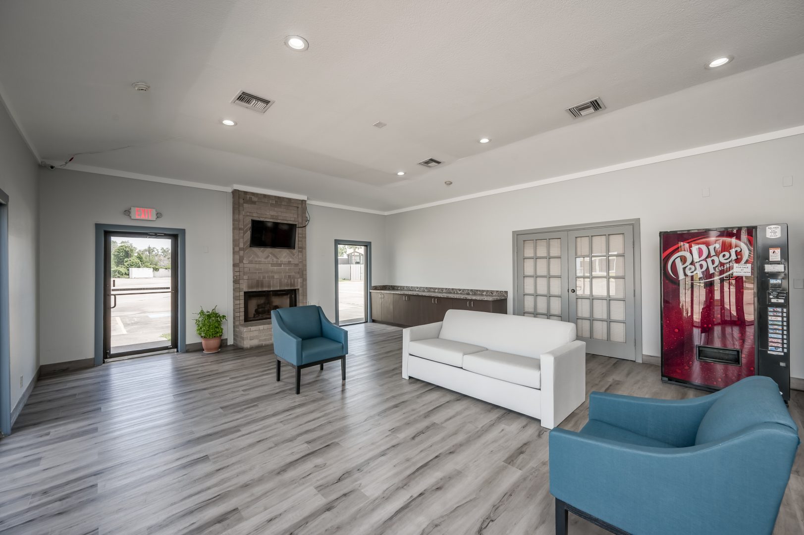 the lobby of a hotel with couches and chairs at The  Studios At Channelview