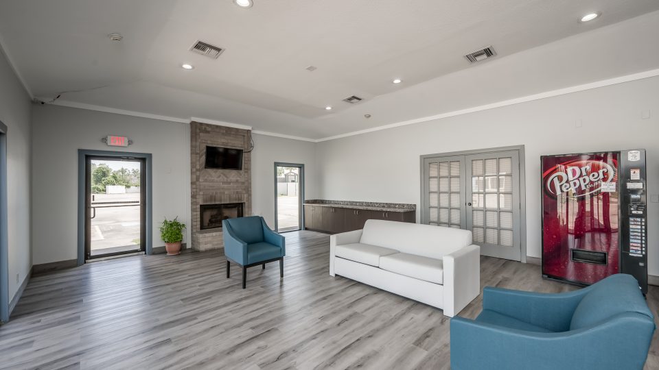 the lobby of a hotel with couches and chairs at The  Studios At Channelview