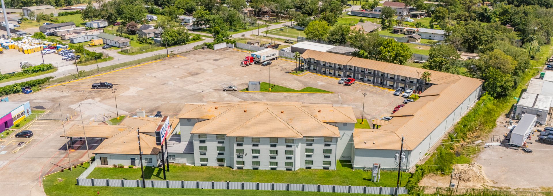 an aerial view of a hotel and parking lot at The  Studios At Channelview