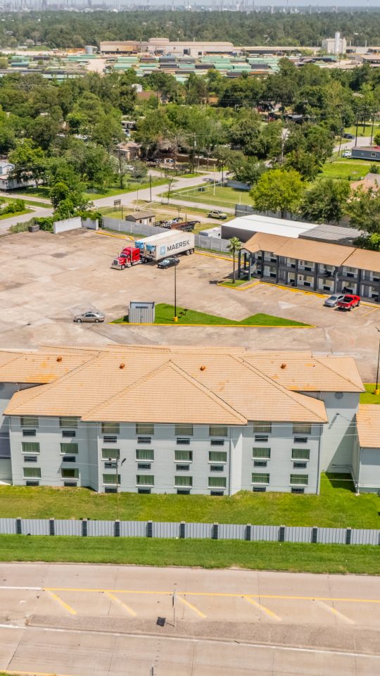 an aerial view of a hotel and parking lot at The  Studios At Channelview